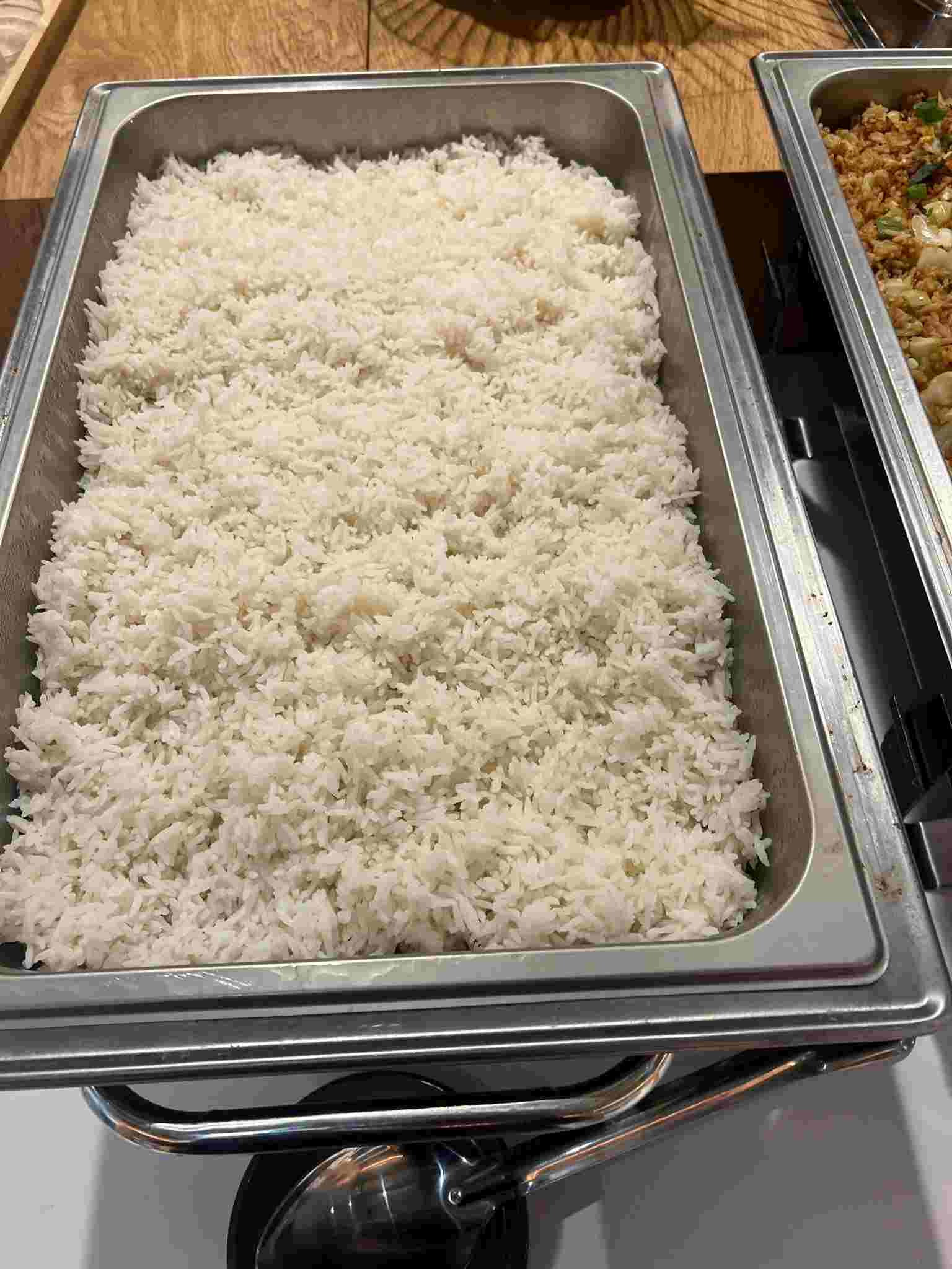 Thai steamed jasmine rice in a catering chafing dish