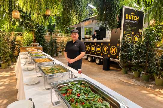 Royal Thai catering buffet set up in chafing dishes with jasmine rice, Thai fried rice, Massaman curry and cashew nut stir-fry