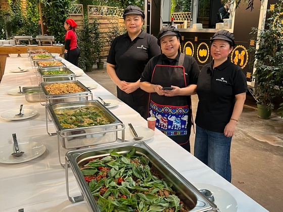 Thai fried rice with vegetables served in a catering tray at a Royal Thai buffet